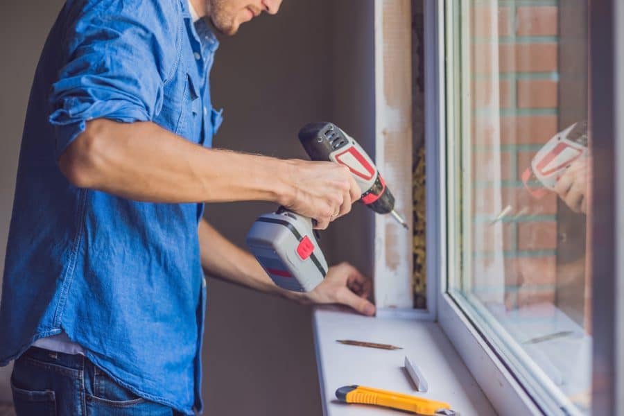 Carpenter working on a window frame